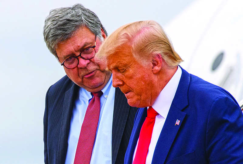 (FILES) In this file photo taken on September 1, 2020 US President Donald Trump (R) and US Attorney General William Barr step off Air Force One upon arrival at Andrews Air Force Base in Maryland. - US Attorney General Bill Barr gave federal prosecutors blanket authorization on November 9 to open investigations into voting irregularities, as President Donald Trump claimed that he lost the presidential election due to fraud.nBarr, long a close defender of Trump, stresed that his letter to US attorneys around the country was not an indication that the Justice Department had evidence yet of genuine cases. (Photo by MANDEL NGAN / AFP)