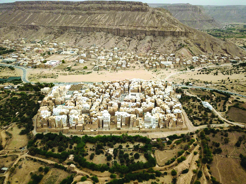 An aerial picture taken on October 17, 2020, shows a view of Shibam City in Yemen's central Hadramawt governorate. - Against the backdrop of what resembles the Grand Canyon stands Yemen's ancient city of Shibam, the 'Manhattan of the desert' that has largely been spared by war but remains at the mercy of natural disasters. (Photo by - / AFP)