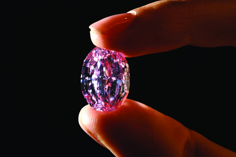 A picture taken on November 6, 2020 in Geneva shows the ìThe Spirit of the Roseî a rare 14.83 carats vivid purple pink diamond during a press preview ahead of sales by Sotheby's auction house. - The exceptional ball-sized pink gem, shaped from the largest rough pink diamond ever discovered in Russia, will be offered in Geneva on 11 November by Sotheby's, which estimates it at between 23 and 38 million dollars. (Photo by Fabrice COFFRINI / AFP)