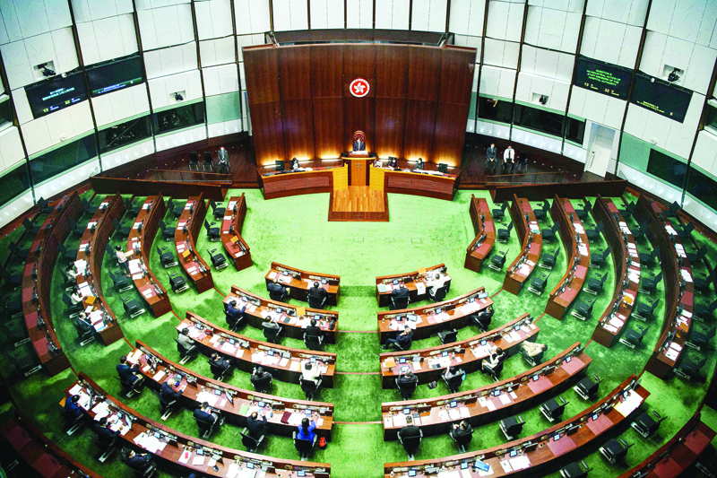 TOPSHOT - A general view shows the main chamber of the Legislative Council in Hong Kong on November 12, 2020. - Hong Kong's legislature sat empty of pro-democracy lawmakers on November 12 after the bloc announced it would resign in protest at Beijing, turning the semi-autonomous city's once-feisty legislature into a gathering of Chinese loyalists. (Photo by Anthony WALLACE / AFP)