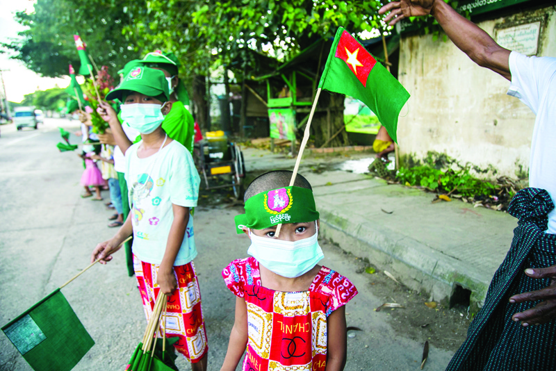 Supporters of the Union Solidarity and Development Party (USDP) attend an election campaign event in Yangon on November 4, 2020, ahead of the November 8 general election. (Photo by Sai Aung MAIN / AFP)