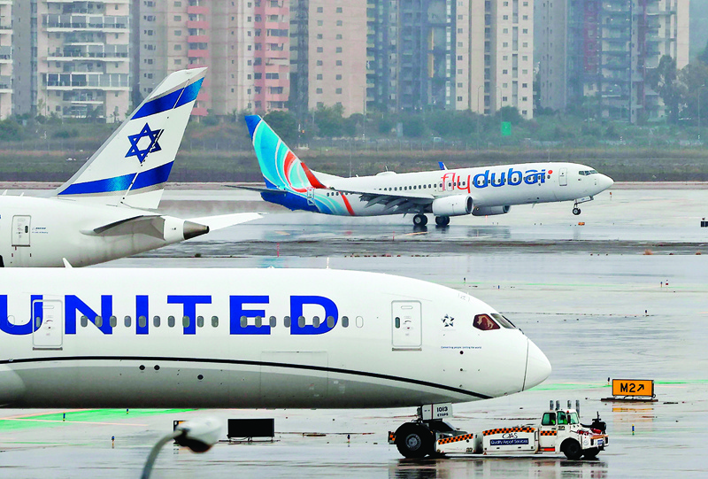 An airplane of budget airline flydubai lands at Israel's Ben Gurion aiport near Tel Aviv on November 26, 2020 on the first scheduled commercial service between the two cities, following the normalisation of ties between the UAE and Israel. (Photo by JACK GUEZ / AFP)