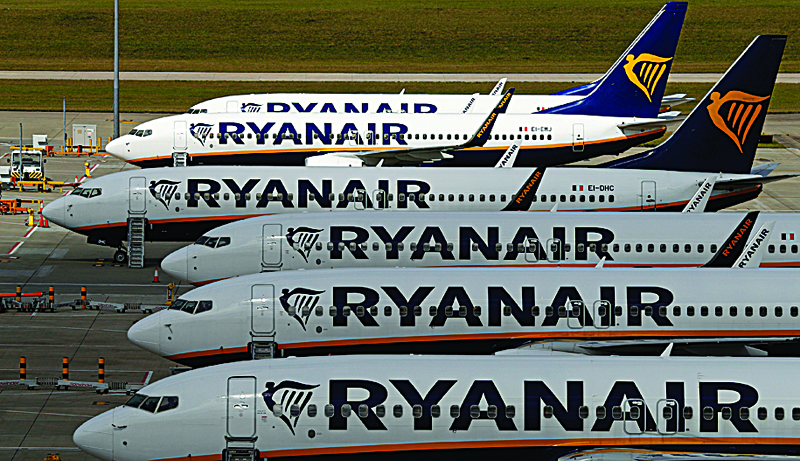 (FILES) In this file photo taken on August 20, 2020 Ryanair aircraft are pictured at Stansted airport, northeast of London. - Irish no-frills airline Ryanair said on November 2, 2020, that it sank into a net loss in the first half of its financial year, as coronavirus savaged demand and grounded planes worldwide. (Photo by Adrian DENNIS / AFP)