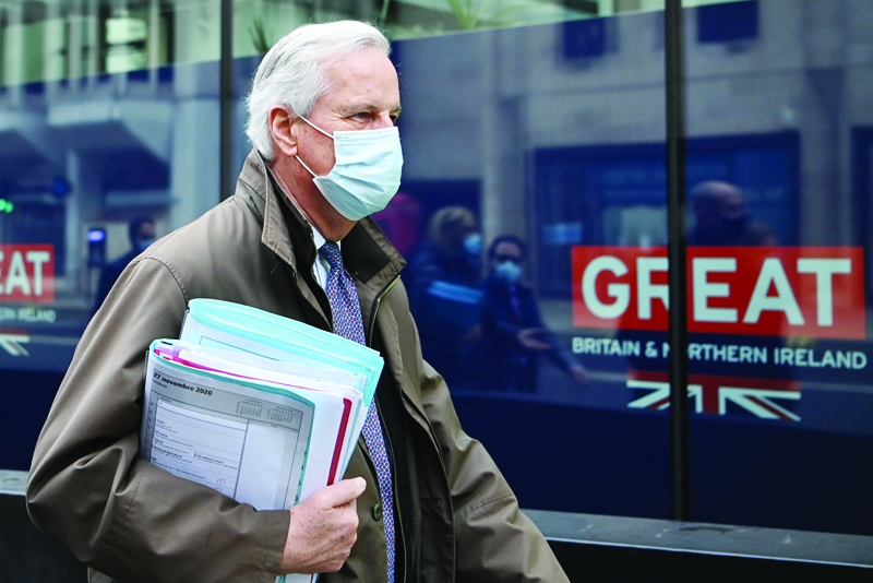 EU chief negotiator Michel Barnier wearing a protective face covering to combat the spread of the coronavirus, walks to a conference centre to continue negotiations on a trade deal between the EU and the UK in London on November 29, 2020. - Britain has been largely trading on the same terms with the EU since it officially left the bloc in January as part of a transition agreement that expires at the end of the year. As it stands, it will leave Europe's trade and customs area in five weeks with talks on a follow-on agreement stalled over fishing rights and fair trade rules. (Photo by DANIEL LEAL-OLIVAS / AFP)