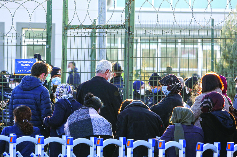 Families wait to enter the Sincan Penal Institution at the 4th Heavy Penal Court near Ankara, on November 26, 2020. - A Turkish court will hand down verdicts on November 26  to nearly 500 suspects in one of the main trials stemming from the bloody 2016 coup attempt against President Recep Tayyip Erdogan. Fethullah Gulen, a US-based Muslim preacher who was once an Erdogan ally, is accused of ordering the failed putsch. His movement has been proscribed as a terrorist group by Ankara, although he strongly denies all charges. (Photo by STRINGER / AFP)