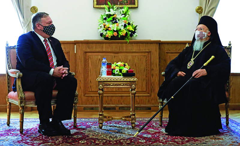 US Secretary of State Mike Pompeo (L) meets with Ecumenical Orthodox Patriarch Bartholomew I (R) at the Greek Orthodox Patriarchate in Istanbul on November 17, 2020 during his visit to Europe and Middle East. - Pompeo's only announced meeting in Turkey is with Patriarch Bartholomew I of Constantinople -- the spiritual leader of the Greek Orthodox world -- to discuss religious freedom, a key topic for the evangelical Christian Pompeo. No meetings with Turkish officials are planned during his visit to the country, not even with his counterpart Mevlut Cavusoglu. (Photo by UMIT BEKTAS / POOL / AFP)