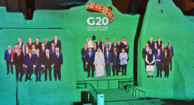 A photomontage of G20 Leaders is projected at the historic site of al-Tarif in Diriyah district, on the outskirts of Saudi capital Riyadh, ahead of G20 virtual summit on November 20, 2020. - Saudi Arabia hosts the G20 summit in a first for an Arab nation, with the downsized virtual forum dominated by efforts to tackle a resurgent coronavirus pandemic and crippling economic crisis. (Photo by FAYEZ NURELDINE / AFP)