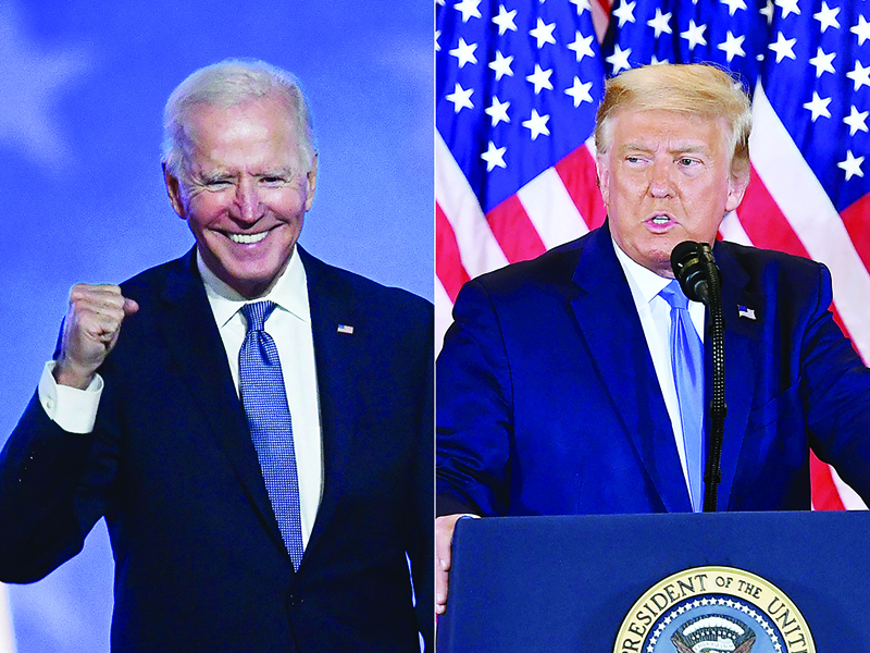 TOPSHOT - (COMBO) This combination of pictures created on November 4, 2020 shows Democratic presidential nominee Joe Biden gestures after speaking during election night at the Chase Center in Wilmington, Delaware, and US President Donald Trump speaks during election night in the East Room of the White House in Washington, DC, early on November 4, 2020. - President Donald Trump and Democratic challenger Joe Biden are battling it out for the White House, with polls closed across the United States Tuesday -- and a long night of waiting for results in key battlegrounds on the cards. (Photos by ANGELA  WEISS and MANDEL NGAN / AFP)
