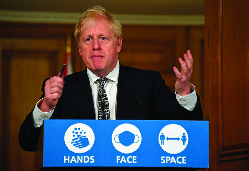 Britain's Prime Minister Boris Johnson speaks during a virtual press conference inside 10 Downing Street in central London on October 31, 2020 to announce new lockdown restrictions in an effort to curb rising infections of the novel coronavirus. - UK Prime Minister Boris Johnson on Saturday announced a new four-week coronavirus lockdown across England, a dramatic strategy shift following warnings hospitals would become overwhelmed under his current system of localised restrictions. (Photo by Alberto Pezzali / POOL / AFP)