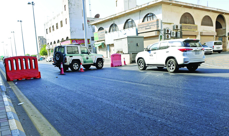Saudi police close a street leading to a non-Muslim cemetery in the Saudi city of Jeddah where a bomb struck a World War I commemoration attended by European diplomats on November 11, 2020 leaving several people wounded amid Muslim anger over French cartoons. - The attack is the second assault in the kingdom in less than a month, as French President Emmanuel Macron has sought to assuage anger across Muslim nations over satirical cartoons of the Prophet Mohammed. (Photo by - / AFP)