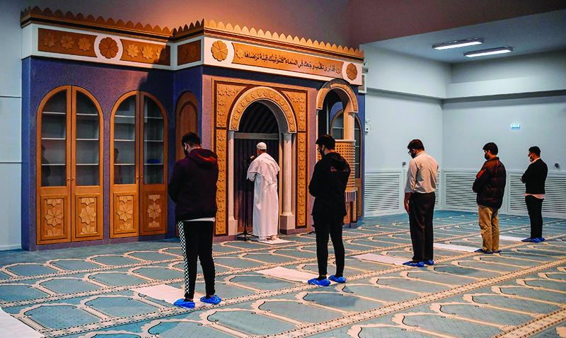 Muslim worshippers pray in the first official mosque in the Greek capital Athens, a day after its opening on November 3, 2020. - The first official mosque in Athens, delayed for more than a decade, opened its doors to a few faithful owing to the coronavirus, the capital's Muslim community said November 3, 2020. The project to open a state-sanctioned mosque in Athens, the only European capital without one, was launched in 2007. Some 650,000 Muslims live in Greece, the majority in Athens. Most are migrants who arrived in the country over the last 20 years. (Photo by LOUISA GOULIAMAKI / AFP)