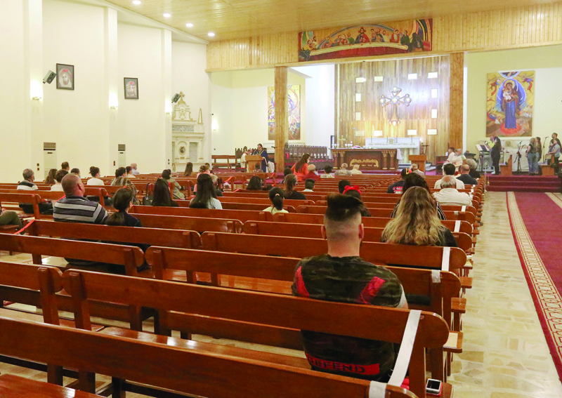 Worshippers attend mass at the Chaldean Church of St. Joseph in the Iraqi capital Baghdad, on November 7, 2020. - A few hundred thousand Christians are left in Iraq, where a US-led invasion in 2003 paved the way for bloody sectarian warfare that devastated the country's historic and diverse Christian communities -- Assyrian, Armenian, Chaldean, Protestant and more -- that were directly targeted later, as local hardliners fought each other starting in 2006. (Photo by Sabah ARAR / AFP)