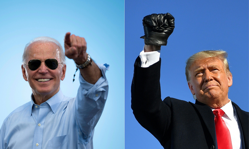 (FILES)(COMBO) This combination of pictures created on October 30, 2020 shows Democratic Presidential candidate and former US Vice President Joe Biden gestures prior to delivering remarks at a Drive-in event in Coconut Creek, Florida, on October 29, 2020 and US President Donald Trump pumps his fist as he arrives to a campaign rally at Green Bay Austin Straubel International Airport in Green Bay, Wisconsin on October 30, 2020. - President Donald Trump and Democrat Joe Biden fought November 2, 2020 through the eve of an election threatened by legal chaos and fears of violence after Trump, down in the polls and with only hours to go, pushed hard to discredit the US voting process.On Tuesday, the world will witness a country more divided and angry than at any time since the Vietnam War era of the 1970s. (Photos by JIM WATSON and MANDEL NGAN / AFP)