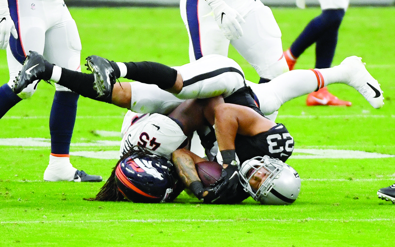LAS VEGAS, NEVADA - NOVEMBER 15: Running back Devontae Booker #23 of the Las Vegas Raiders is tackled by inside linebacker A.J. Johnson #45 of the Denver Broncos in the first half of their game at Allegiant Stadium on November 15, 2020 in Las Vegas, Nevada. The Raiders defeated the Broncos 37-12.   Ethan Miller/Getty Images/AFP