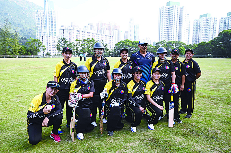CORRECTION - This picture taken on November 8, 2020 shows the SCC Divas cricket team, made up of domestic helpers from the Philippines, posing for a team photo ahead of their game against the Hong Kong Cricket Club Cavaliers in Hong Kong. (Photo by Peter PARKS / AFP) / TO GO WITH Cricket-HKG-PHI-HongKong-Philippines,FOCUS by Talek HARRIS / ìThe erroneous mention[s] appearing in the metadata of this photo by Peter PARKS has been modified in AFP systems in the following manner: [Hong Kong Cricket Club Cavaliers] instead of [Kong Cricket Club Cavaliers]. Please immediately remove the erroneous mention[s] from all your online services and delete it (them) from your servers. If you have been authorized by AFP to distribute it (them) to third parties, please ensure that the same actions are carried out by them. Failure to promptly comply with these instructions will entail liability on your part for any continued or post notification usage. Therefore we thank you very much for all your attention and prompt action. We are sorry for the inconvenience this notification may cause and remain at your disposal for any further information you may require.î
