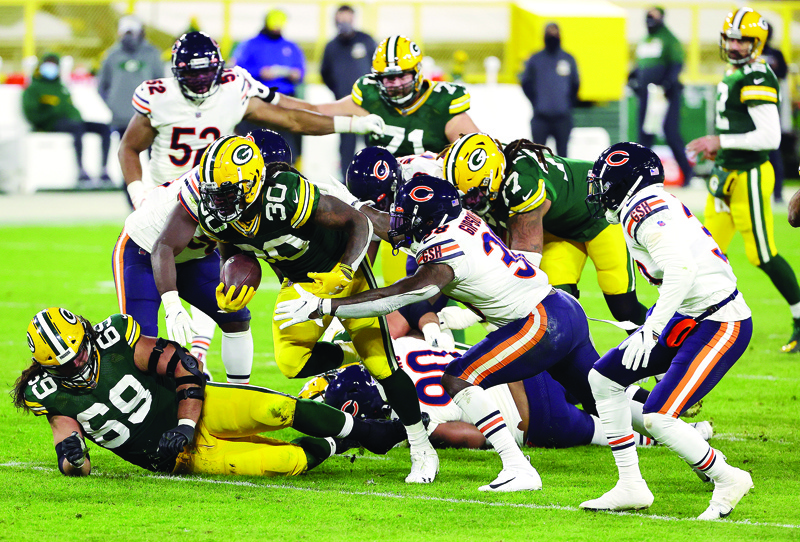 GREEN BAY, WISCONSIN - NOVEMBER 29: Jamaal Williams #30 of the Green Bay Packers during the 2nd half of the game against the Chicago Bears at Lambeau Field on November 29, 2020 in Green Bay, Wisconsin.   Stacy Revere/Getty Images/AFP