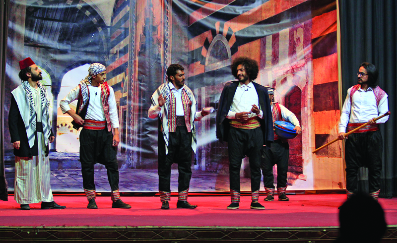 Yemeni actors rehearse on the eve of the premiere of a play entitled 'Yemeni Film', a comedic production that touches on the current struggles of local artists, in the capital Sanaa, on December 23, 2020. - The three showings of the play were a welcomed distraction and rare in the country that the United Nations says is the world's worst humanitarian crisis, which has only gotten worse with the spread of the novel coronavirus.nTens of thousands of people have been killed in Yemen since 2015, when a Saudi-led coalition intervened to support the government after Huthi rebels took control of Sanaa the year before (Photo by MOHAMMED HUWAIS / AFP)