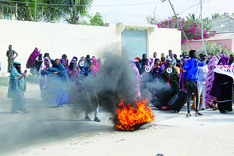 CORRECTION - Women take part in a demonstration against the Somali President Mohamed Abdulahi Farmajo on December 15, 2020 accused of interferences in the electoral process. (Photo by STRINGER / AFP) / ìThe erroneous mention appearing in the metadata of this photo by STRINGER has been modified in AFP systems in the following manner: [a demonstration against the Somali President Mohamed Abdulahi Farmajo] instead of [a demonstration against the Somali Prime Minister]. Please immediately remove the erroneous mention from all your online services and delete it from your servers. If you have been authorized by AFP to distribute it to third parties, please ensure that the same actions are carried out by them. Failure to promptly comply with these instructions will entail liability on your part for any continued or post notification usage. Therefore we thank you very much for all your attention and prompt action. We are sorry for the inconvenience this notification may cause and remain at your disposal for any further information you may require.î