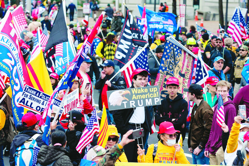 TOPSHOT - Supporters of US President Donald Trump rally at Freedom Plaza in Washington, DC, on December 12, 2020, to protest the 2020 election. (Photo by Jose Luis Magana / AFP)
