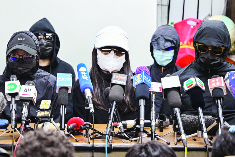 Family members of a group of Hong Kong democracy activists, who tried to flee the city by speedboat to Taiwan last August, hold a press conference in Hong Kong on December 28, 2020, the first day of their trial across the border in the Chinese city of Shenzhen. (Photo by Peter PARKS / AFP)