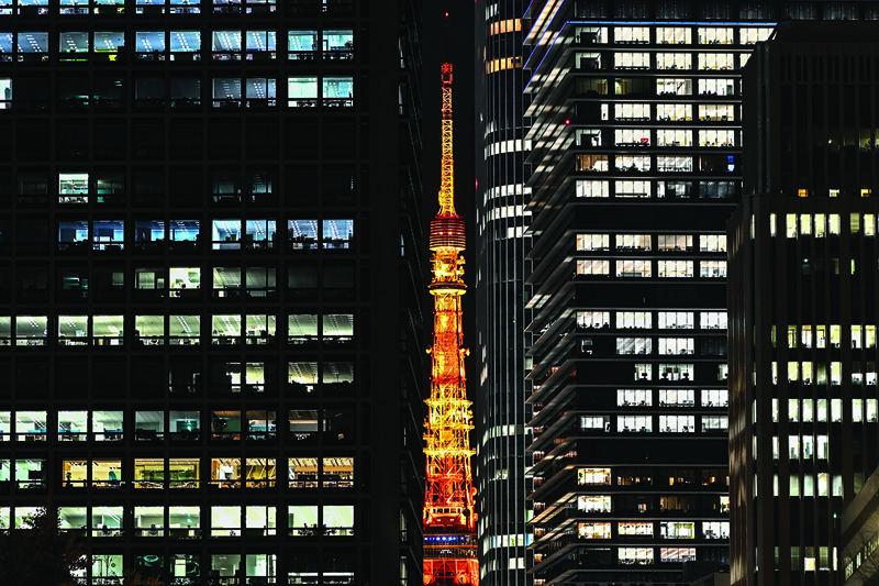 The Tokyo Tower is seen at night in the Japanese capital on December 14, 2020. (Photo by CHARLY TRIBALLEAU / AFP)