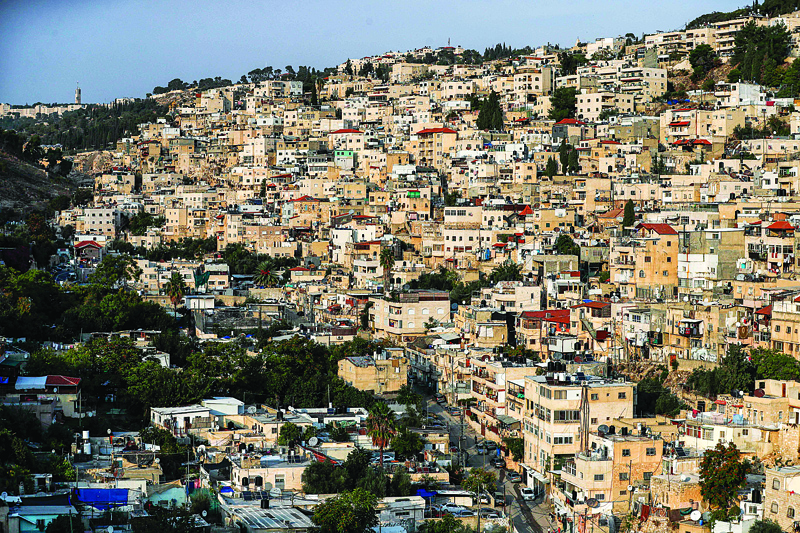 This picture shows a view of the predominantly Arab neighbourhood of Silwan, just outside the Old City in Israeli-annexed east Jerusalem, on November 9, 2020, - In 1970, Israel passed a law allowing Jews to reclaim property they had lost in or before 1948, the year of Israel's creation which also saw authority over east Jerusalem pass from British to Jordanian control. nIn cases where former east Jerusalem Jewish landowners or their heirs were unavailable, Israel granted administration of the land rights to a government entity called the General Custodian. (Photo by AHMAD GHARABLI / AFP)