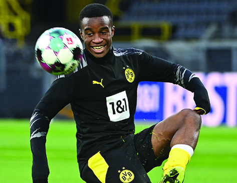 (FILES) In this file photo taken on December 12, 2020 Dortmund's German forward Youssoufa Moukoko warms up on the ball prior the German first division Bundesliga football match BVB Borussia Dortmund v VfB Stuttgart at the Signal Iduna Park Stadium in Dortmund, western Germany. - Borussia Dortmund's Bundesliga title aspirations suffered a fresh dent on December 18, 2020 as they crashed to a 2-1 defeat at Union Berlin on the night their striker Youssoufa Moukoko became the league's youngest ever goalscorer. (Photo by Ina FASSBENDER / various sources / AFP) / DFL REGULATIONS PROHIBIT ANY USE OF PHOTOGRAPHS AS IMAGE SEQUENCES AND/OR QUASI-VIDEO