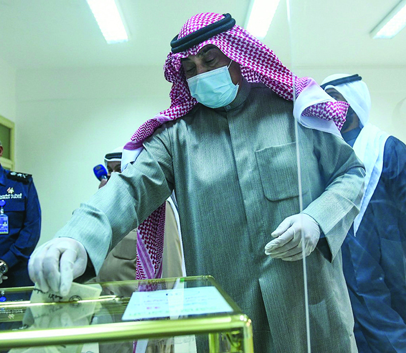 HH the Prime Minister Sheikh Sabah Al-Khaled Al-Hamad Al-Sabah votes at a polling station in Jabriya yesterday.
