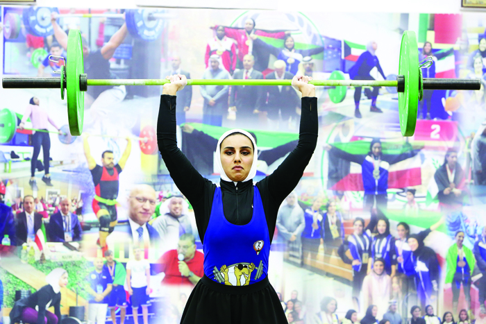Nura al-Awadhi participates in the women weight lifting championship in Kuwait City on December 28, 2020.