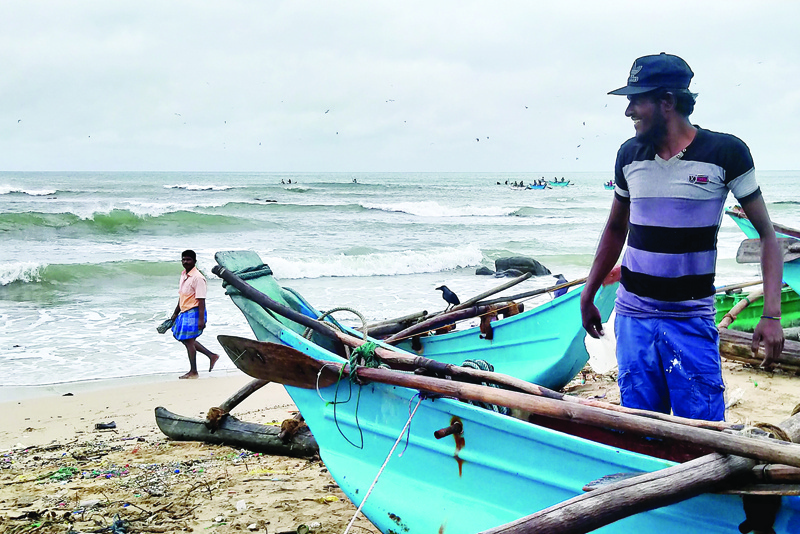 Fishermen prepare to go out in sea in Trincomalee on December 3, 2020. - Cyclone Burevi hit Sri Lanka overnight, rattling the island nation but leaving it relatively unscathed on its way to southern India, officials said on December 3. (Photo by - / AFP)