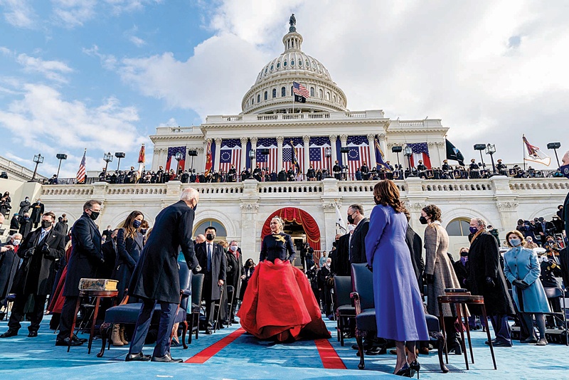 US singer Lady Gaga (center) arrives to perform the National Anthem as President-elect Joe Biden (left) and Vice President-elect Kamala Harris (right) watch during the 59th Presidential Inauguration at the US Capitol in Washington, DC.-AFP photosn