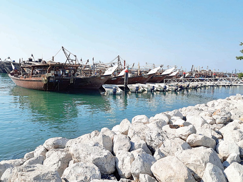 KUWAIT: Traditional fishing dhows lined up at the Shamlan Harbor in Sharq yesterday. - Photo by Fouad Al-Shaikhn
