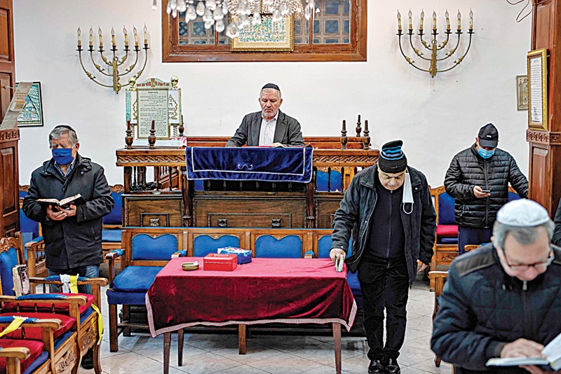 CASABLANCA: Members of the Moroccan Jewish community pray at the synagogue of Em Habanim on Jan 5, 2021. - AFP nn