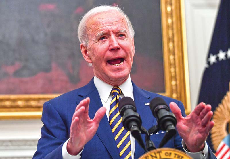 WASHINGTON: In this file photo US President Joe Biden speaks about the COVID-19 response before signing executive orders for economic relief to COVID-hit families and businesses in the State Dining Room of the White House in Washington.-AFP n