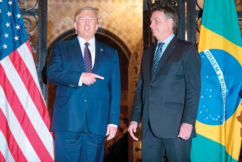 PALM BEACH, Florida: In this file photo taken on March 7, 2020, US President Donald Trump speaks with Brazilian President Jair Bolsonaro at Mar-a-Lago. - AFP n