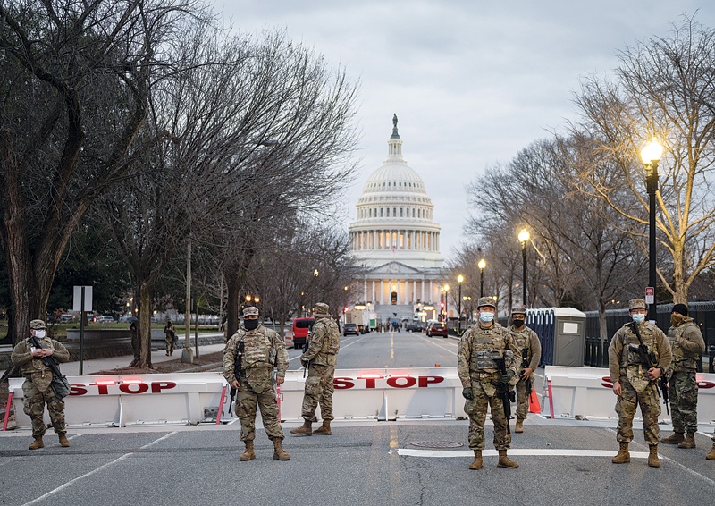 WASHINGTON, DC: Members of the US National Guard stand watch at the US Capitol in Washington, DC on Sunday during a nationwide protest called by anti-government and far-right groups supporting US President Donald Trump and his claim of electoral fraud in the November 3 presidential election. - AFPn
