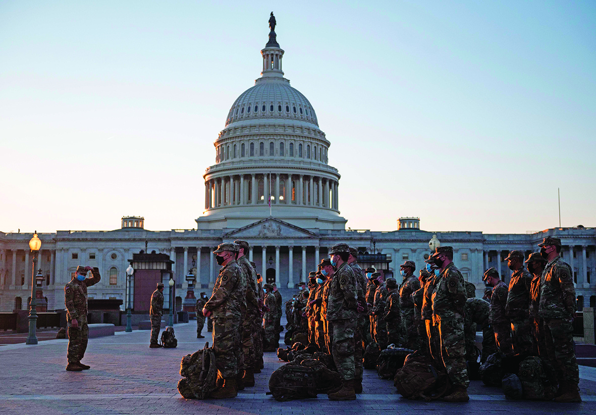 WASHINGTON: Members of the US National Guard arrive at the US Capitol in Washington, DC.-AFP n
