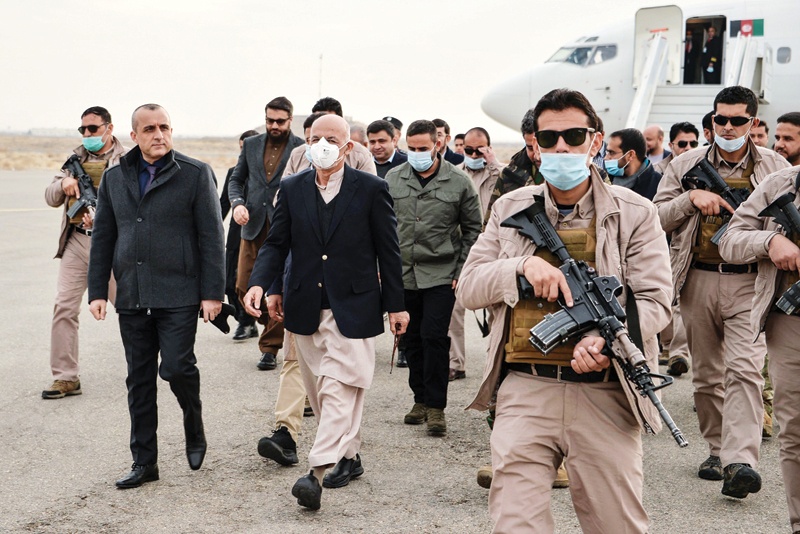 HERAT: Afghan President Ashraf Ghani (center) arrives with the government delegation during a visit in Herat province on Friday.-AFPn