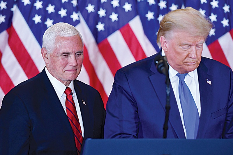 WASHINGTON, DC: In this file photo US President Donald Trump and US Vice President Mike Pence (left) speak during election night in the East Room of the White House in Washington, DC, early on November 4, 2020.  - AFPn