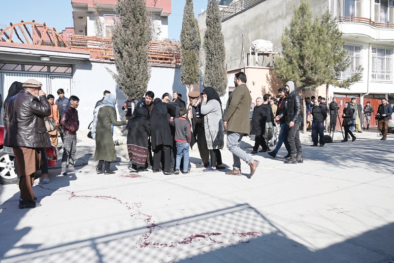 KABUL: Relatives of the victims arrive at the site after gunmen shot dead two Afghan women judges working for the Supreme Court during an early morning ambush in the country's capital in Kabul yesterday. - AFPn