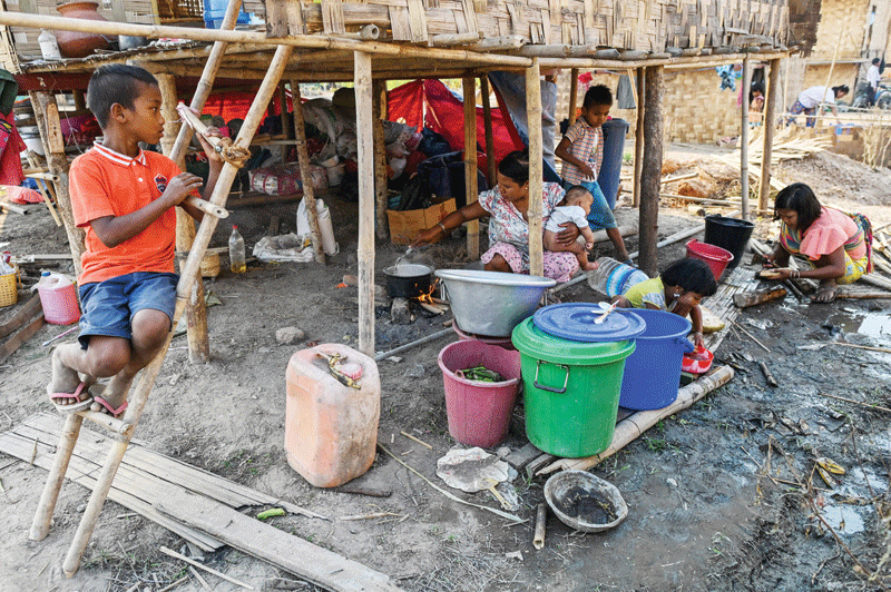 YANGON: This photo shows Chin people working in Bethel village in Hmawbi, on the outskirts of Yangon.-AFP n