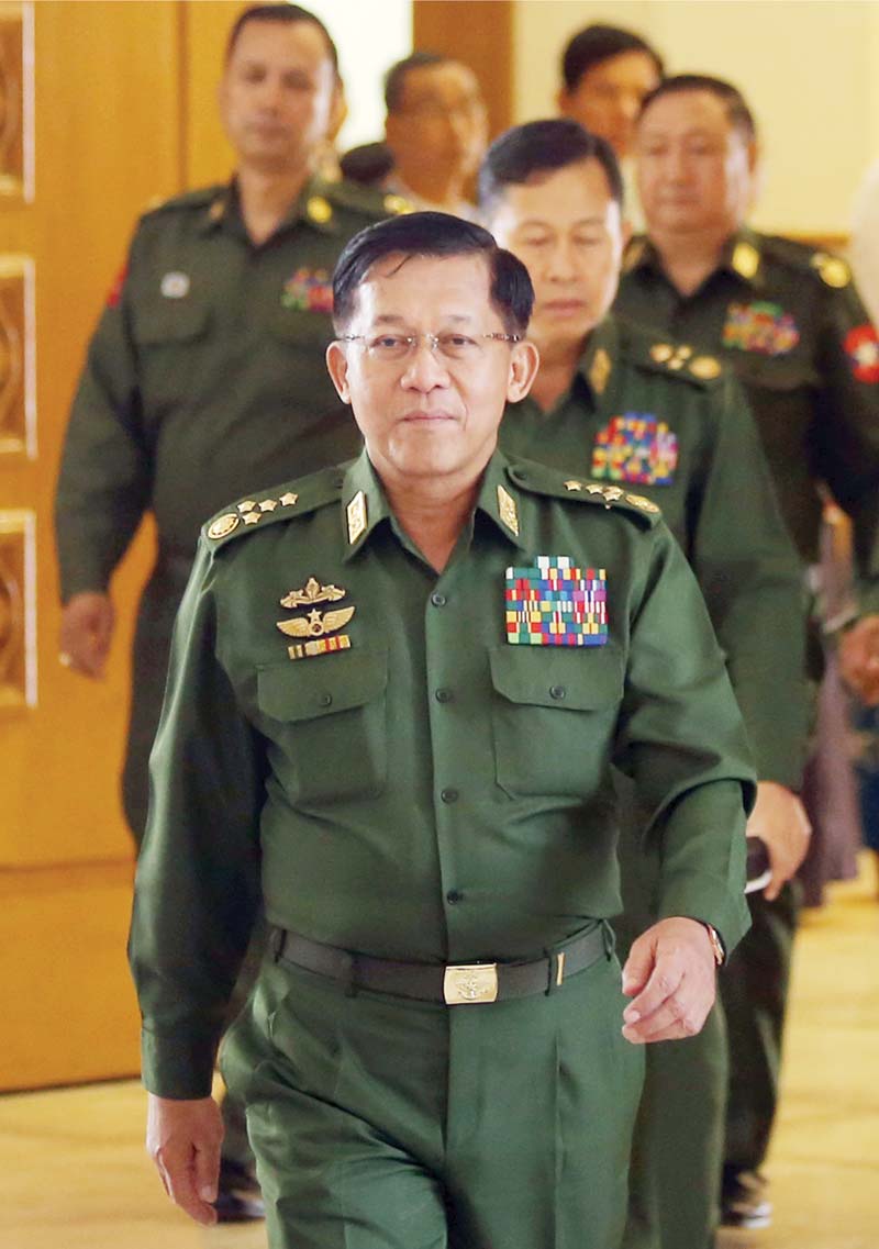 In this file photo, Myanmar military chief Senior General Min Aung Hlaing arrives for the oath taking ceremony of newly appointed Myanmar President Win Myint in the parliament in Naypyidaw. - AFPn