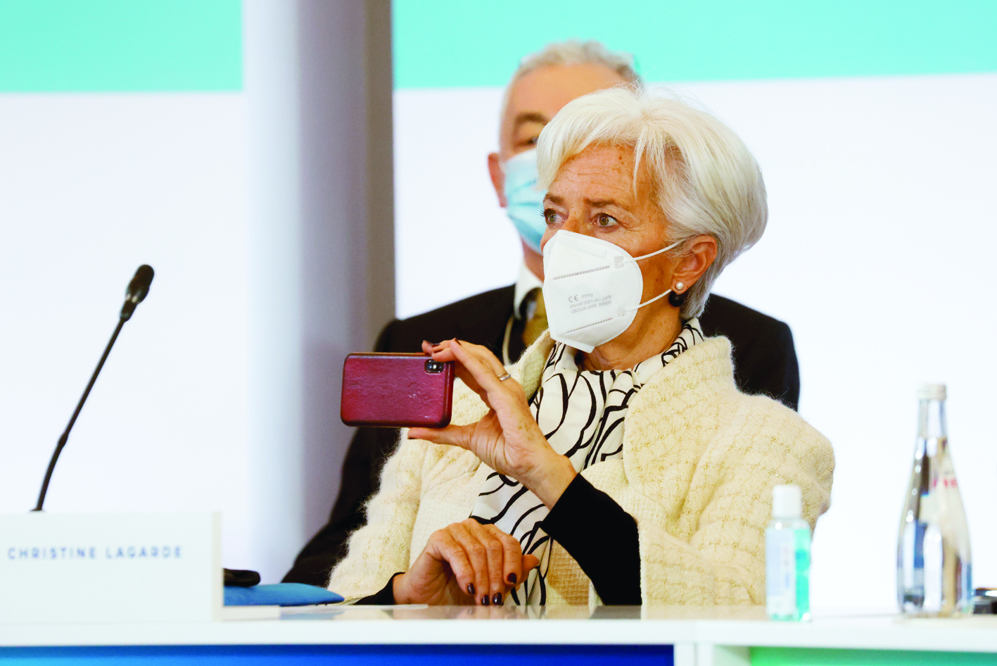 PARIS: President of the European Central Bank (ECB) Christine Lagarde holds her smartphone as she attends the One Planet Summit, part of World Nature Day, at the Reception Room of the Elysee Palace, in Paris, on Tuesday. - AFPn