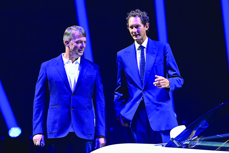 (FILES) In this file photo taken on September 09, 2020 (From L) Fiat Chrysler Automobiles (FCA) CEO, Michael Manley, and FCA Chairman John Elkann attend the presentation of the new sports car of Italian luxury vehicle manufacturer Maserati, the Maserati MC20, on September 9, 2020 at the Modena racetrack. - Elkann is to preside over the board of directors of Stellantis, the future multinational automotive manufacturing corporation resulting of the merger of French automaker Groupe PSA and Italian-American automaker Fiat Chrysler Automobiles, alongside Carlos Tavares, cureent chairman of the PSA board of directors, who will become its managing director. (Photo by MIGUEL MEDINA / AFP)