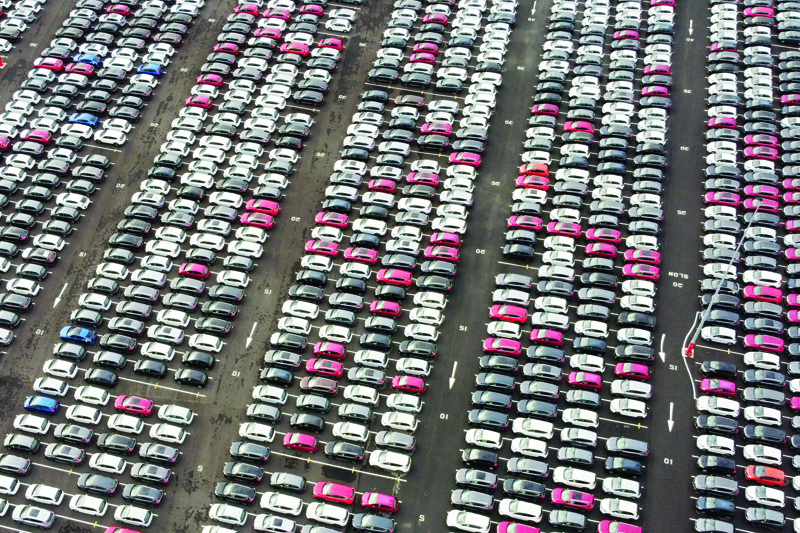 (FILES) In this file photo taken on December 04, 2020 (FILES) In this file photo taken on December 04, 2020 An aerial view shows lines of new Honda cars parked up at the Royal Portbury Dock in Avonmouth, near Bristol in south-west England. - British new car sales crashed to the lowest level for almost three decades in 2020, with demand ravaged by chronic coronavirus fallout and Brexit uncertainty, industry data showed on January 6, 2021. Sales tanked by 29.4 percent compared with 2019 to 1.63 million new vehicles, the Society of Motor Manufacturers and Traders (SMMT) revealed in a statement. That was the lowest level since 1992. (Photo by BEN STANSALL / AFP)
