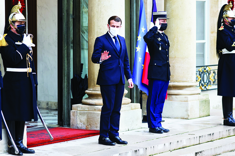 French President Emmanuel Macron arrives to welcome Transition Mali President for a working lunch at the Elysee presidential Palace on January 27, 2021 in Paris.n