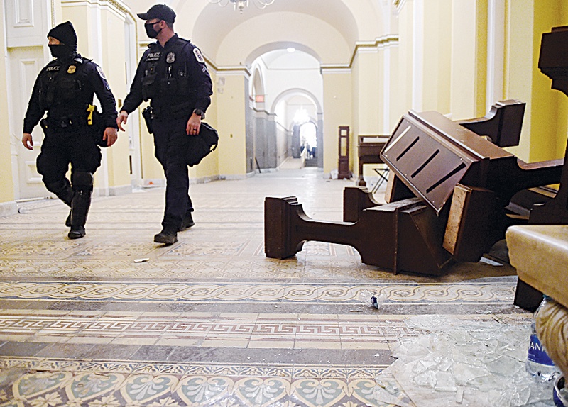 WASHINGTON, DC: Damage is seen inside the US Capitol building early yesterday in Washington, DC, after supporters of US President Donald Trump breeched security and entered the building during a session of Congress. - AFPn