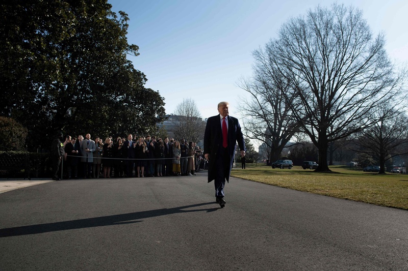 WASHINGTON: US President Donald Trump walks to Marine One after speaking to the press on the South Lawn of the White House yesterday. - AFP n