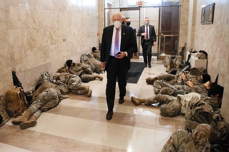 WASHINGTON: House Majority Leader Steny Hoyer walks past members of the National Guard as he arrives at the US Capitol ahead of a House vote impeaching US President Donald Trump yesterday. - AFP  n