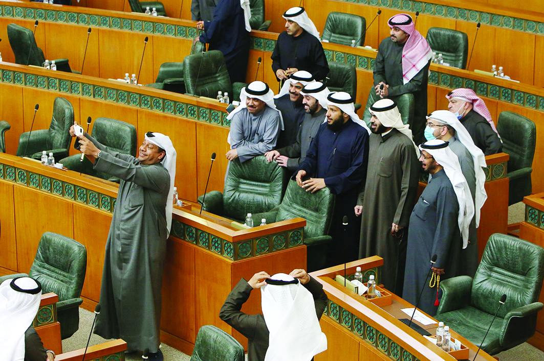KUWAIT: MP Hamad Al-Matar takes a selfie with fellow MPs after the National Assembly session was adjourned yesterday due to the Cabinet's resignation. - Photo by Yasser Al-Zayyatn